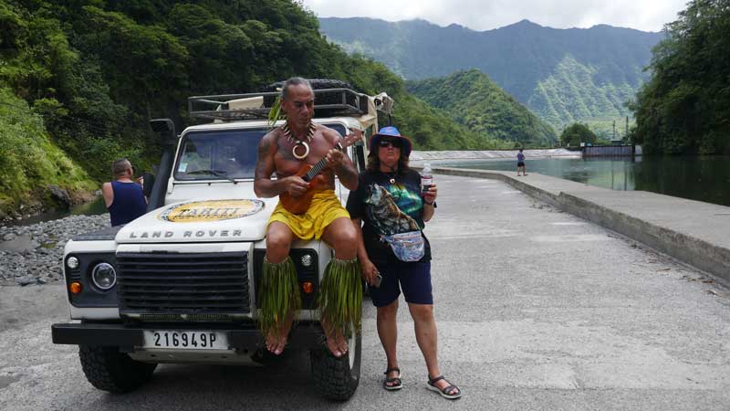 Guide playing Ukulele on tour